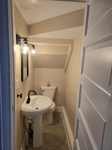 a bathroom with a sink and mirror