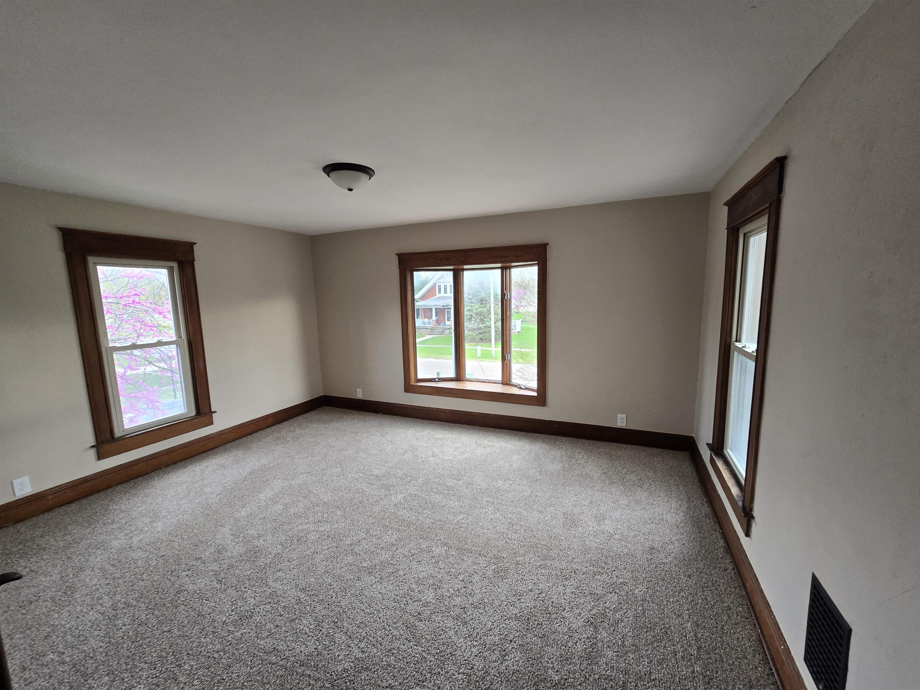 245 Cherry Street Carthage, IL 62321 - Photo 16 of 29 an empty room with windows