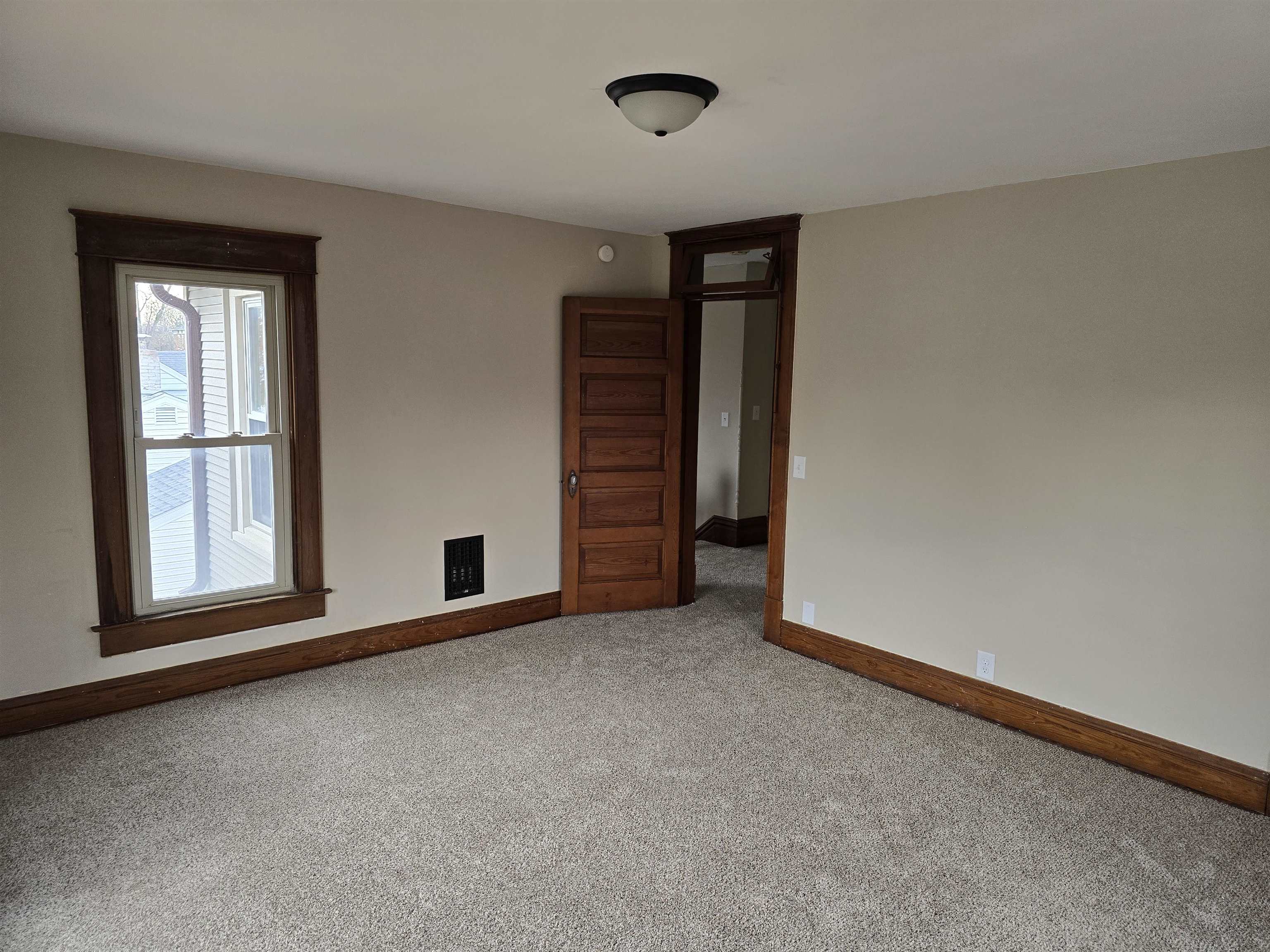 245 Cherry Street Carthage, IL 62321 - Photo 17 of 29 an empty room with windows