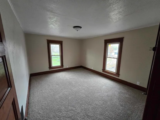 an empty room with windows