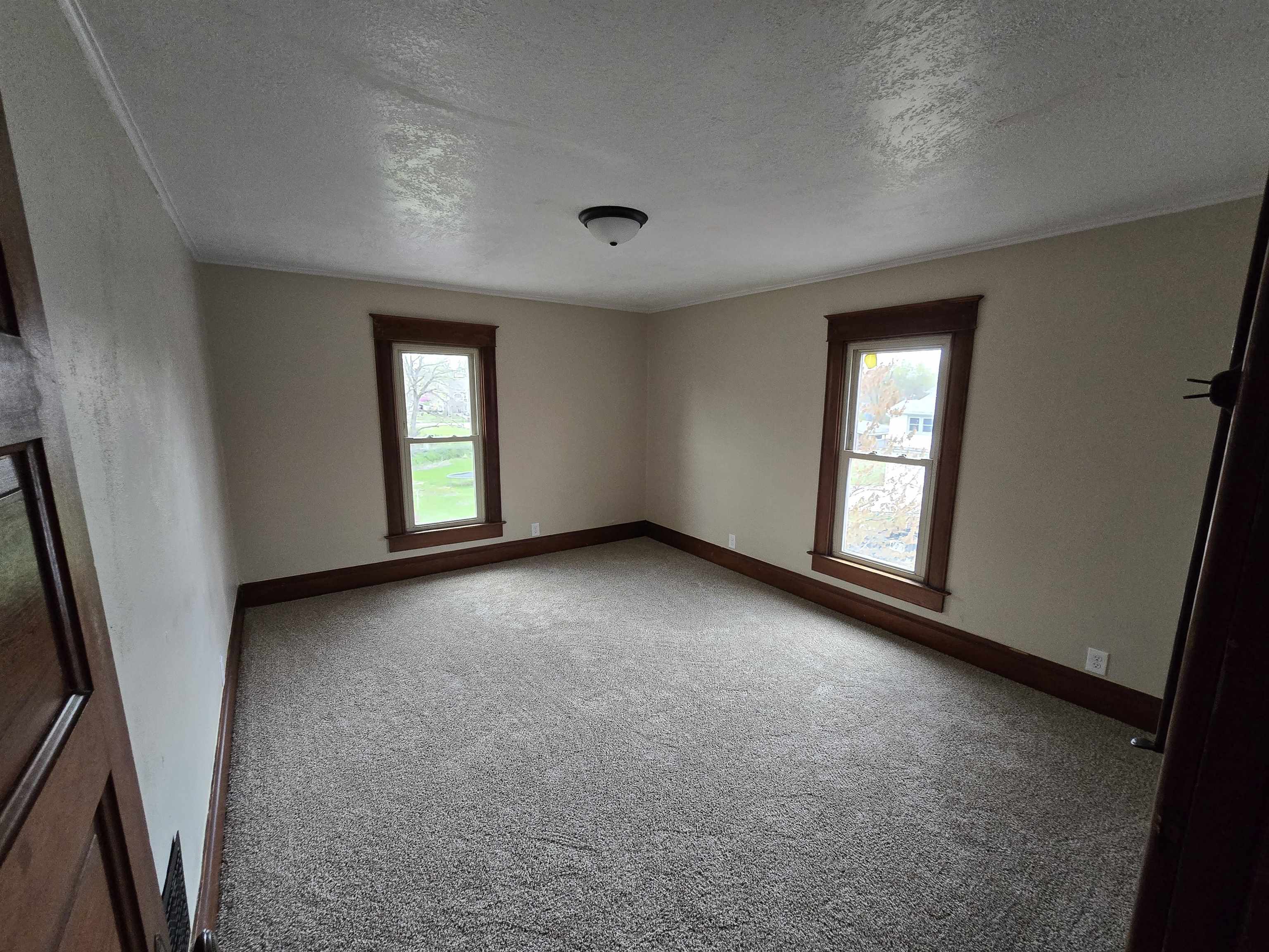 245 Cherry Street Carthage, IL 62321 - Photo 20 of 29 an empty room with windows