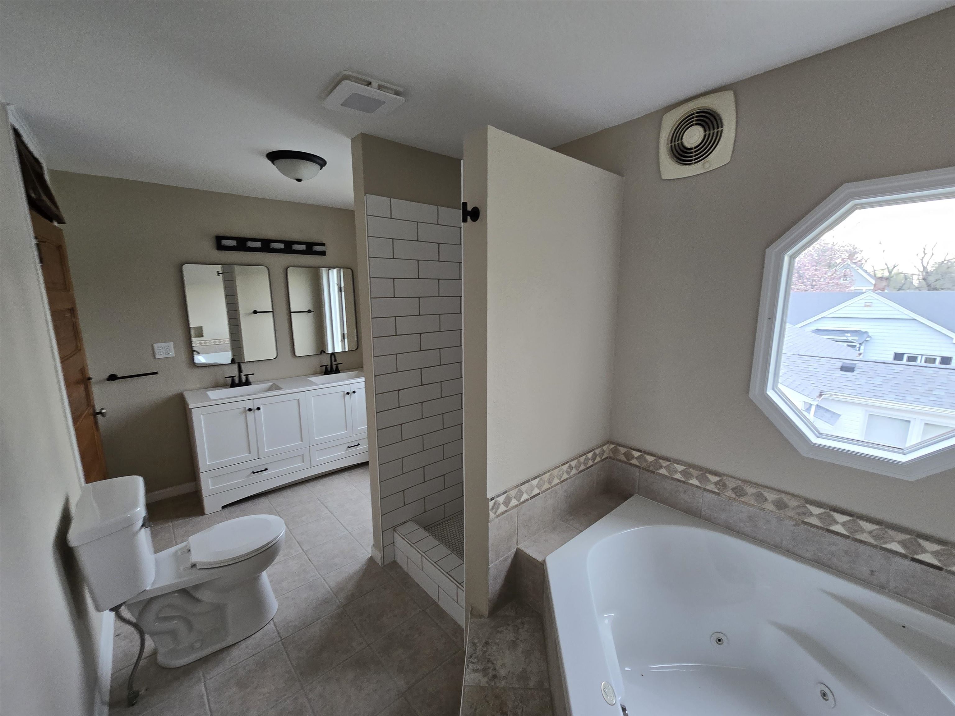 245 Cherry Street Carthage, IL 62321 - Photo 22 of 29 a bathroom with a tub sink and mirror