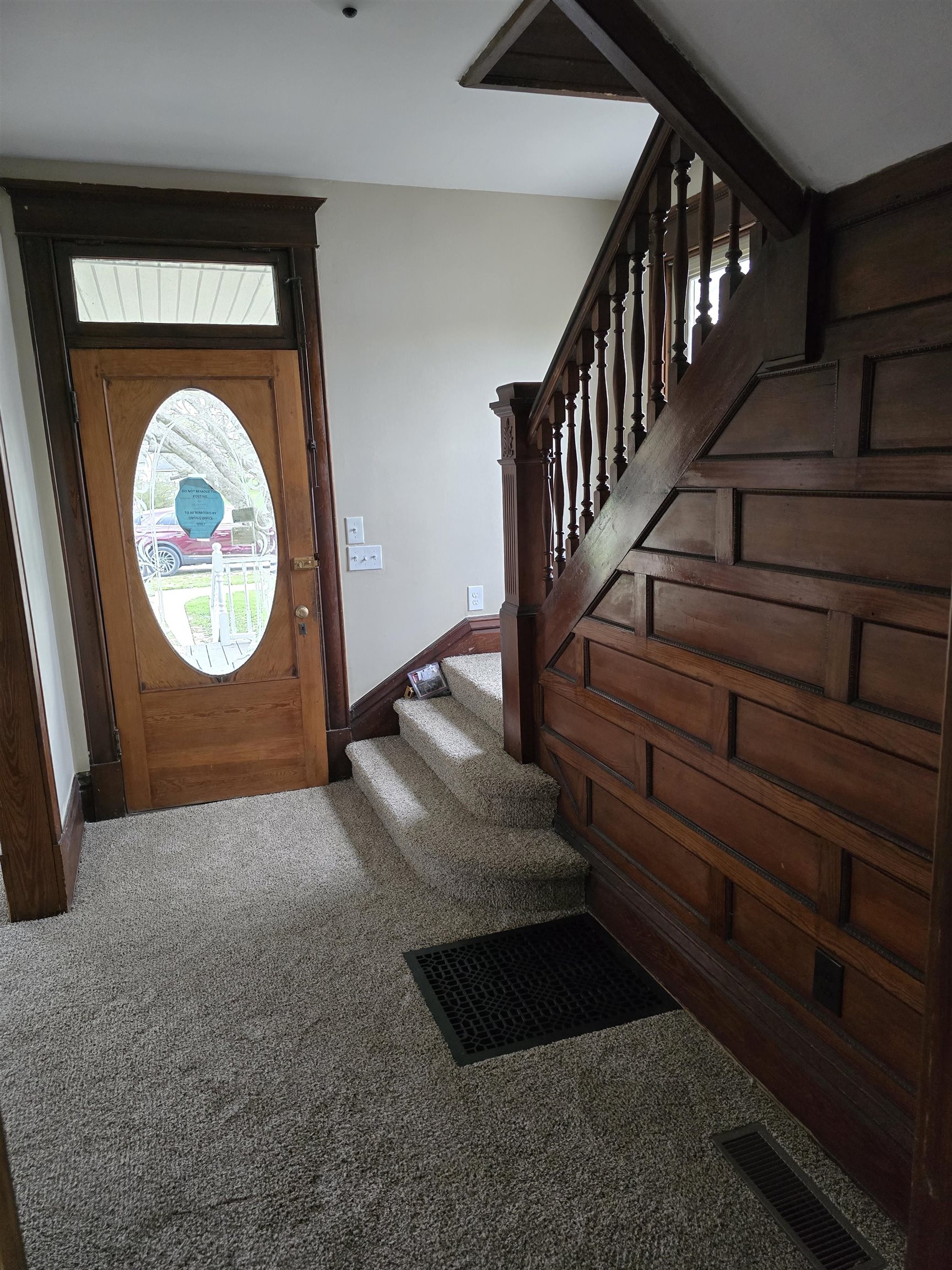 245 Cherry Street Carthage, IL 62321 - Photo 3 of 29 a view of a livingroom with wooden floor and a large window