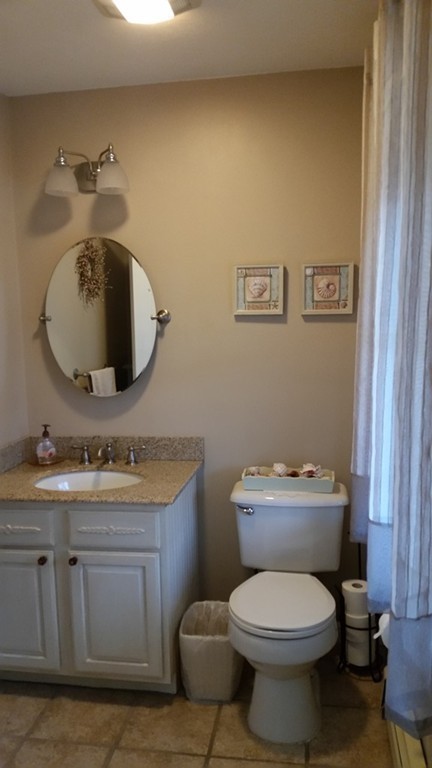 5 Bog Iron Road Wareham, MA 02576 - Photo 17 of 21 a bathroom with a toilet a sink and mirror