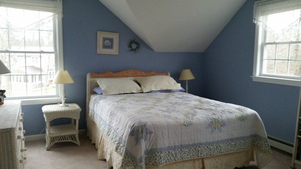 5 Bog Iron Road Wareham, MA 02576 - Photo 18 of 21 a bedroom with a bed chair and window