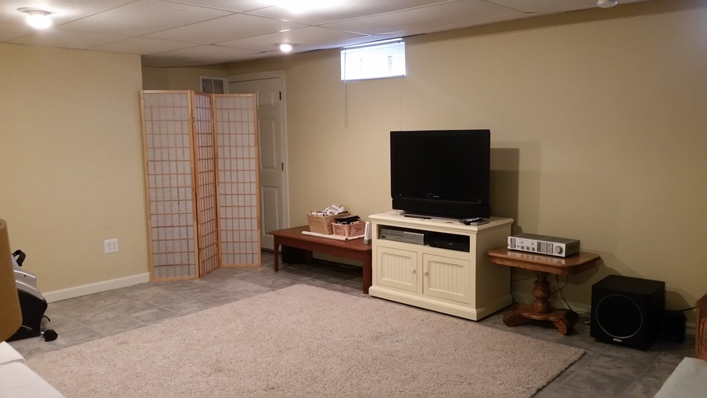 5 Bog Iron Road Wareham, MA 02576 - Photo 21 of 21 a view of a livingroom with furniture and a flat screen tv