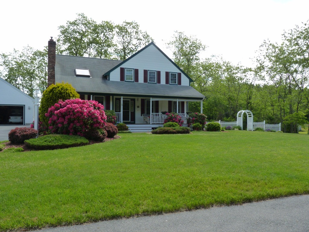 5 Bog Iron Road Wareham, MA 02576 - Photo 3 of 21 a front view of a house with garden