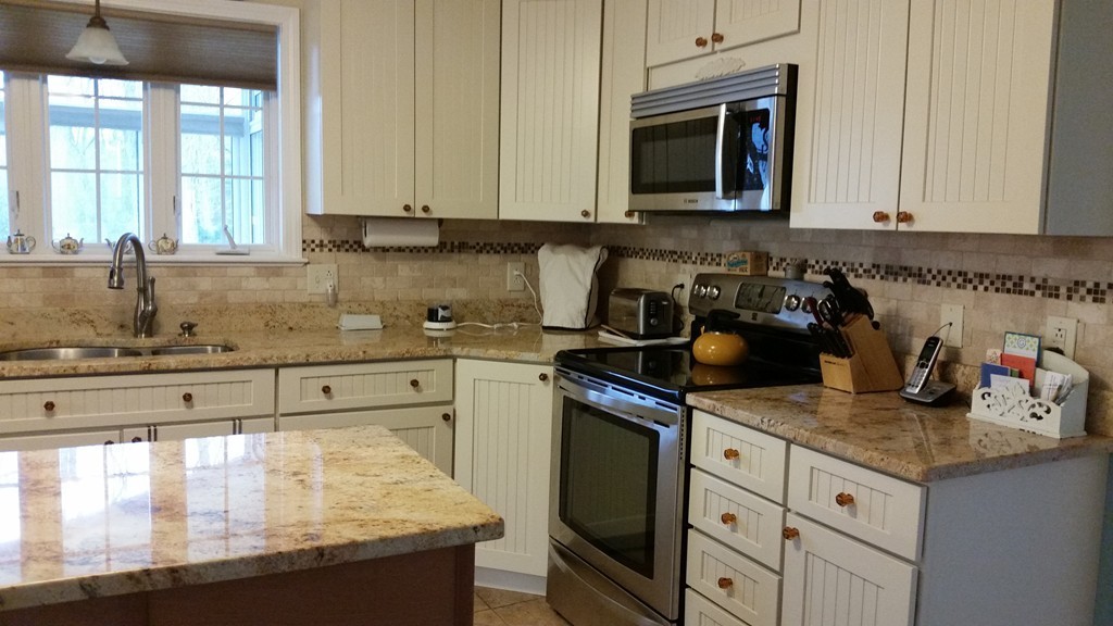 5 Bog Iron Road Wareham, MA 02576 - Photo 7 of 21 a kitchen with stainless steel appliances granite countertop a sink stove and cabinets