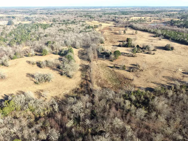a view of a lake with houses in the back
