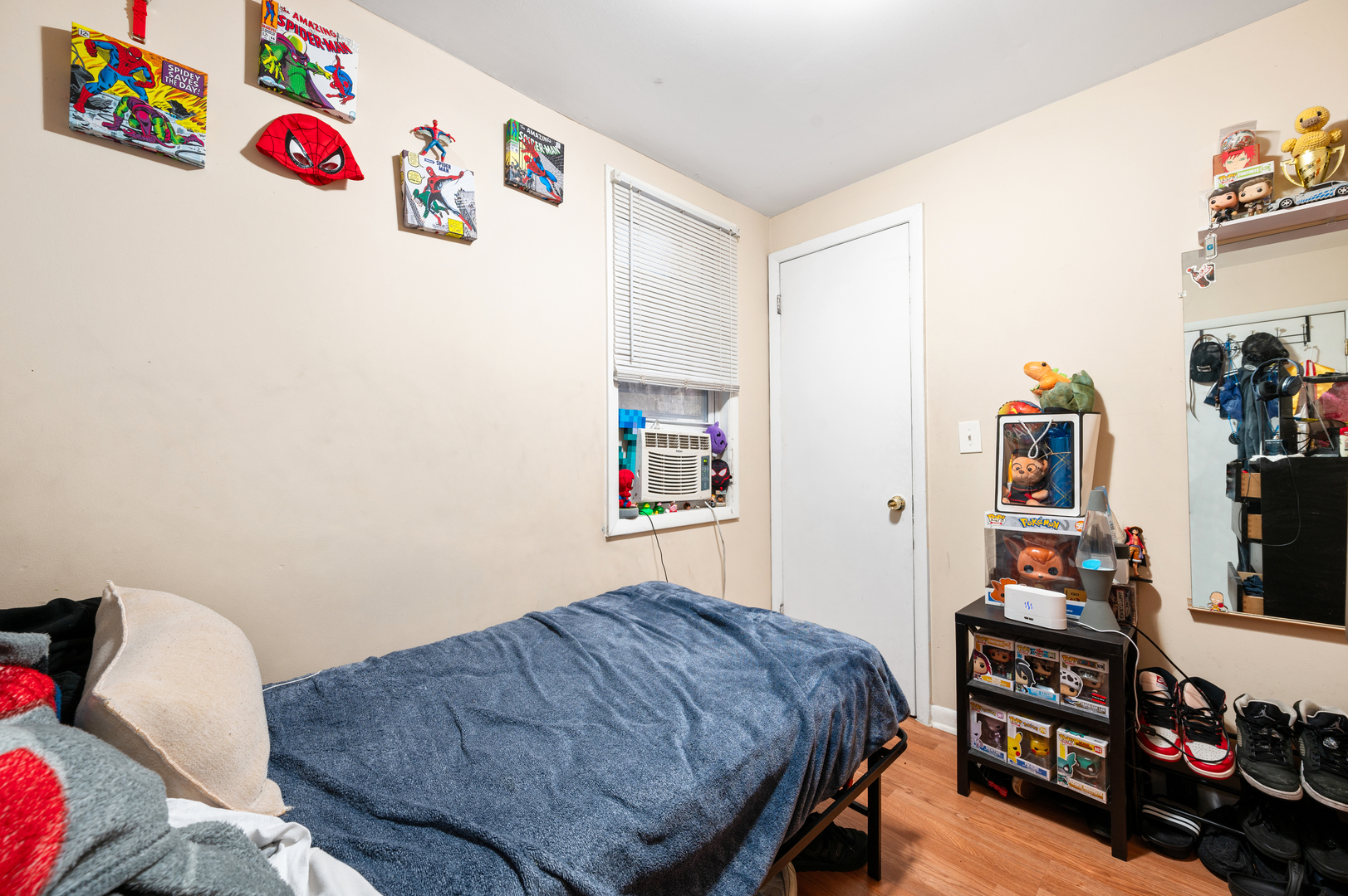 2109 North Karlov Avenue Chicago, IL 60639 - Photo 8 of 22 a bedroom with a bed and cabinets