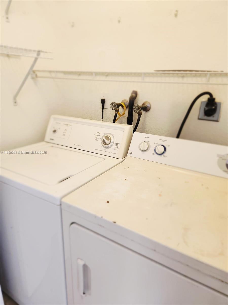 18861 Northwest 86th Court, Unit 3903 Hialeah, FL 33015 - Photo 12 of 14 a utility room with dryer and washer