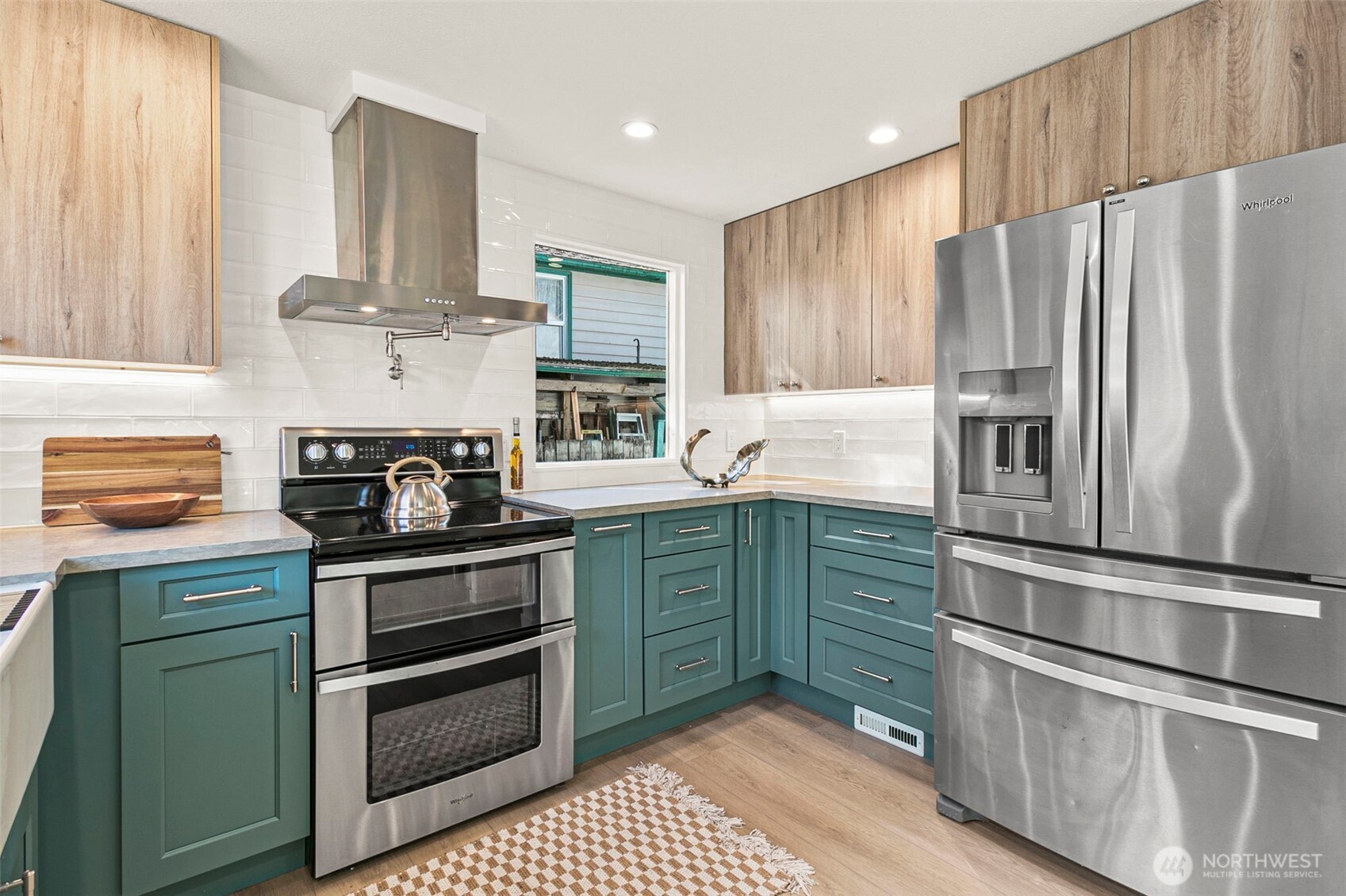 12077 75th Avenue South Seattle, WA 98178 - Photo 1 of 35 a kitchen with stainless steel appliances granite countertop a refrigerator and a stove top oven