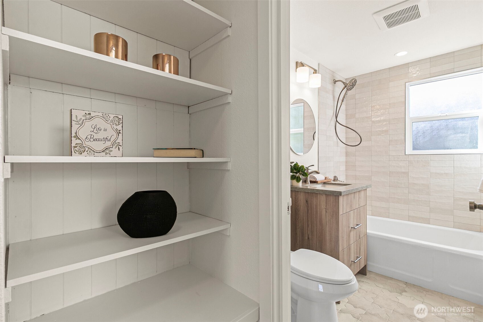 12077 75th Avenue South Seattle, WA 98178 - Photo 20 of 35 a bathroom with a sink a toilet and shower