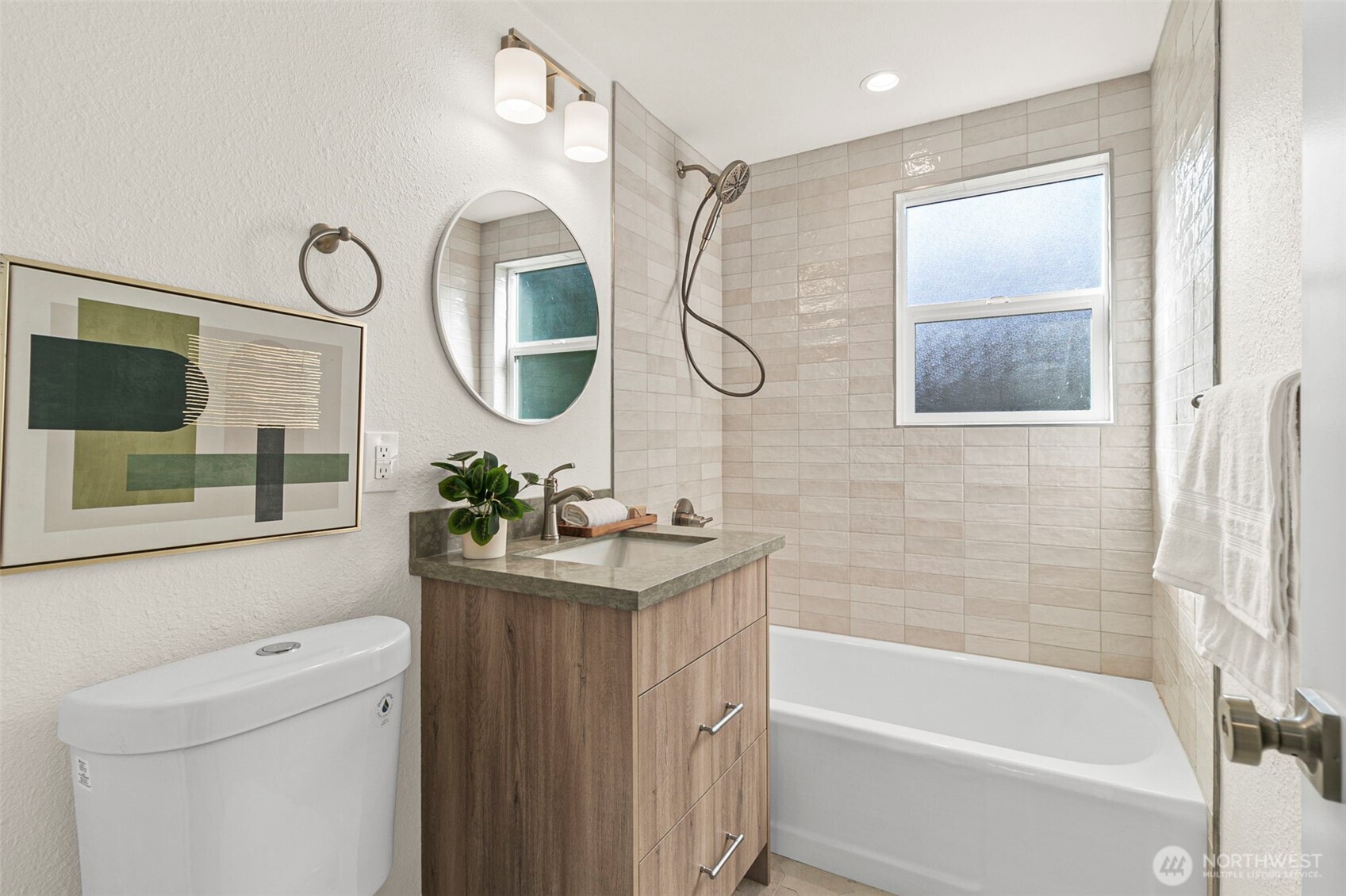 12077 75th Avenue South Seattle, WA 98178 - Photo 21 of 35 a bathroom with a sink a toilet and a mirror