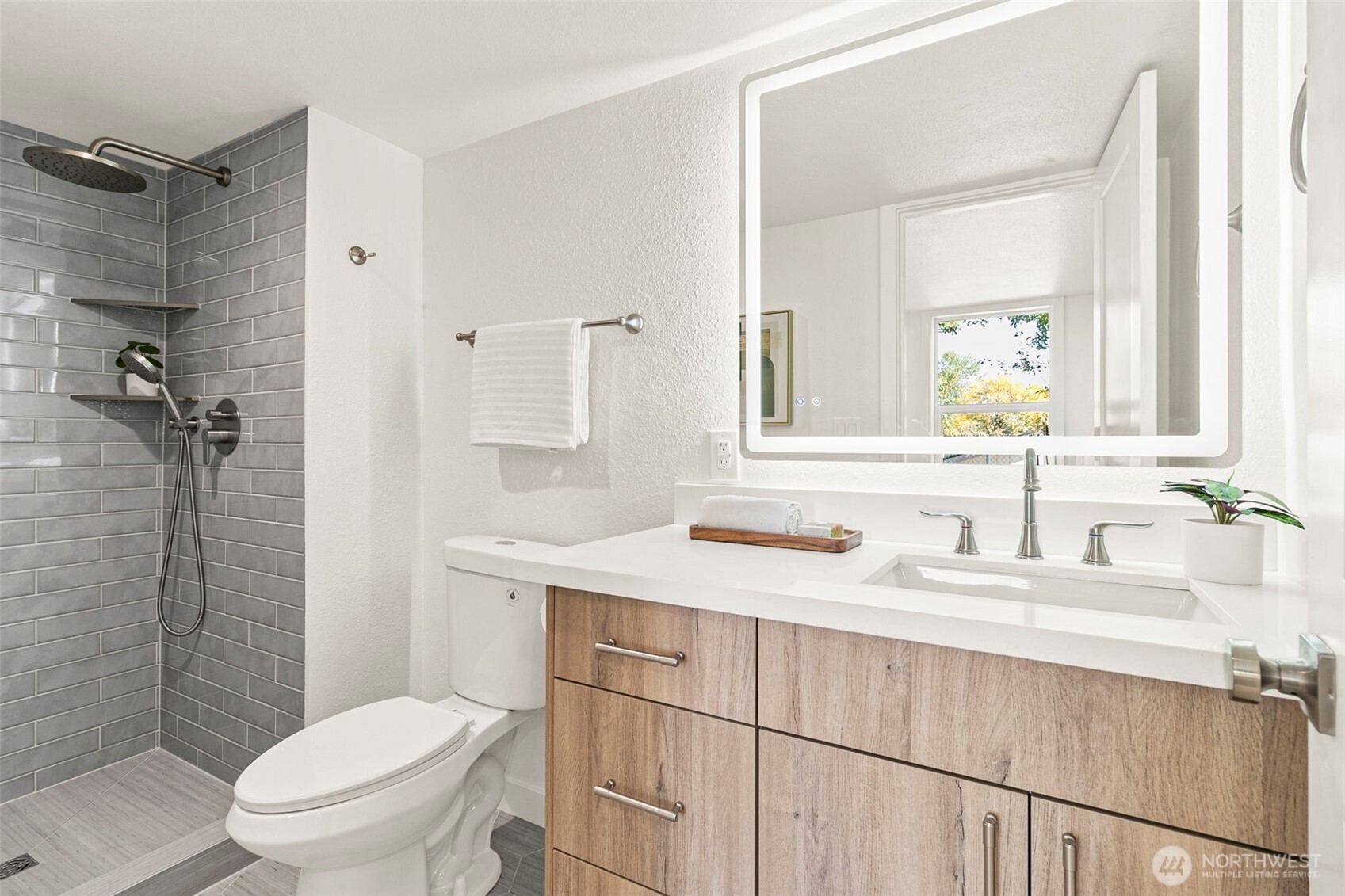 12077 75th Avenue South Seattle, WA 98178 - Photo 28 of 35 a bathroom with a sink toilet vanity and shower