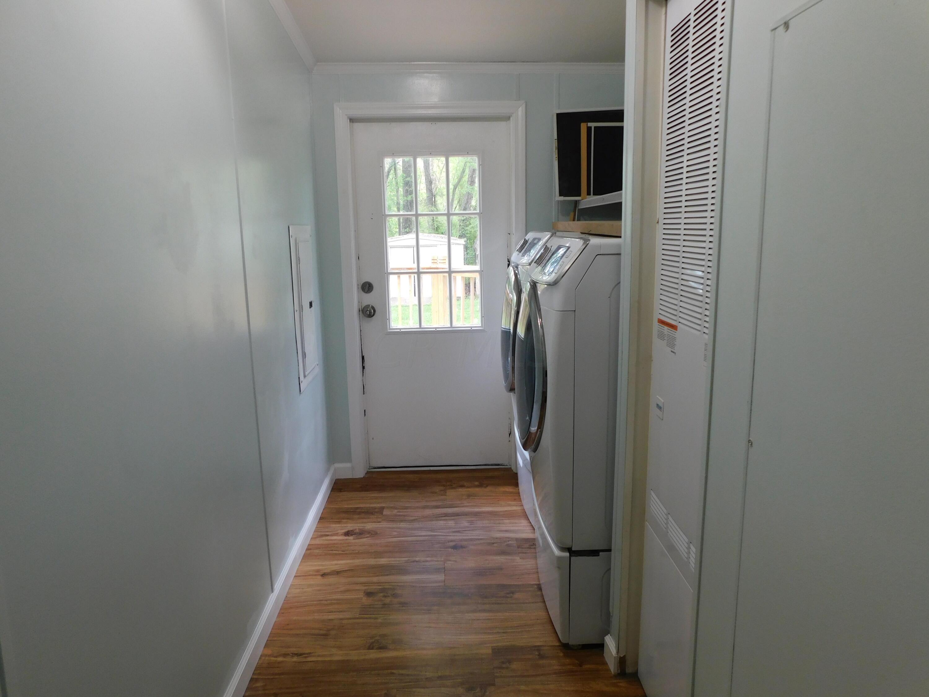 4711 Walnut Road, Unit LOT H8 Buckeye Lake, OH 43008 - Photo 30 of 42 Laundry Room leading out to the back deck.