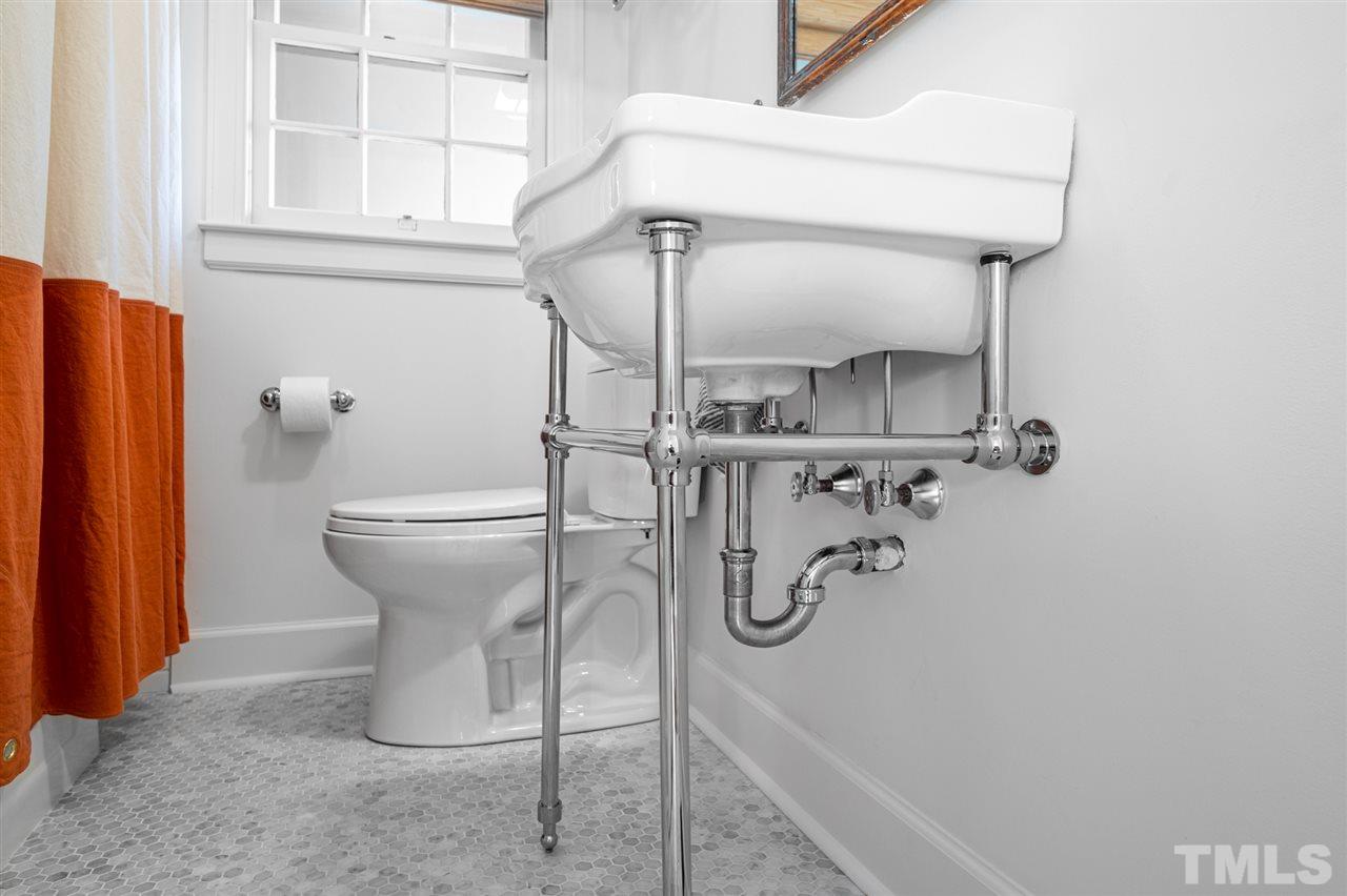 311 Dacian Avenue Durham, NC 27701 - Photo 20 of 30 a bathroom with a shower