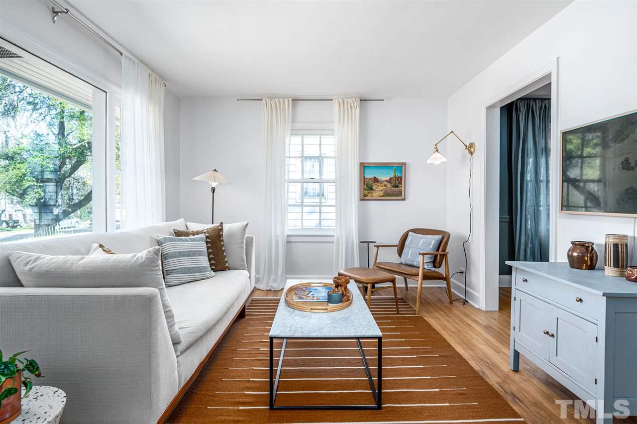 311 Dacian Avenue Durham, NC 27701 - Photo 3 of 30 a living room with furniture a large window and a rug