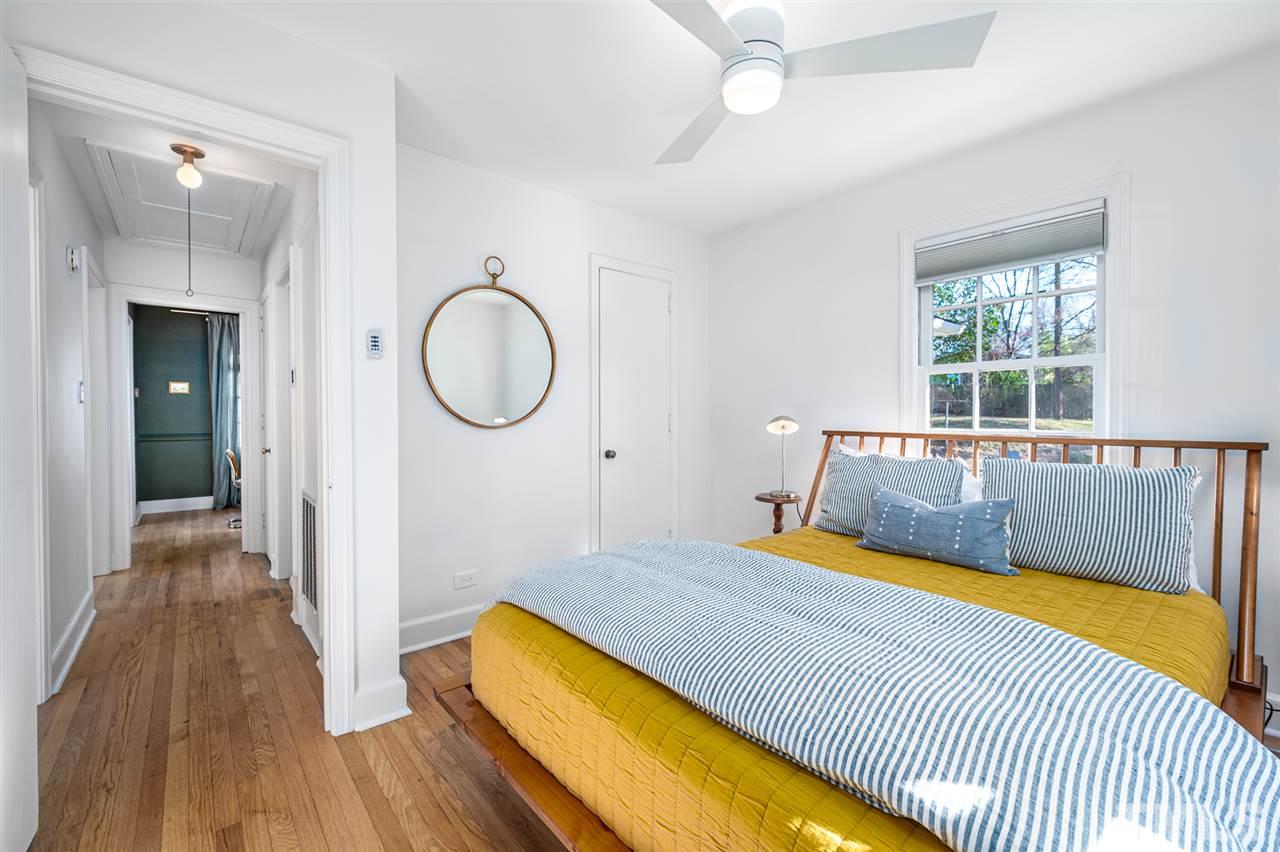 311 Dacian Avenue Durham, NC 27701 - Photo 22 of 30 a bedroom with a bed and a large window