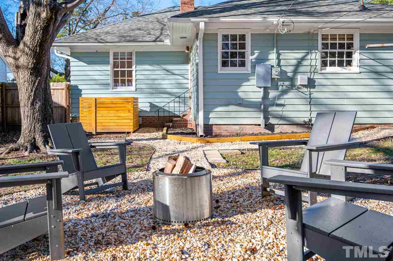 311 Dacian Avenue Durham, NC 27701 - Photo 27 of 30 a view of a patio with chairs and a grill