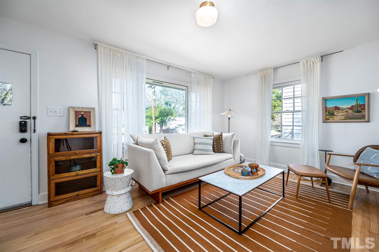 311 Dacian Avenue Durham, NC 27701 - Photo 4 of 30 a living room with furniture and a window