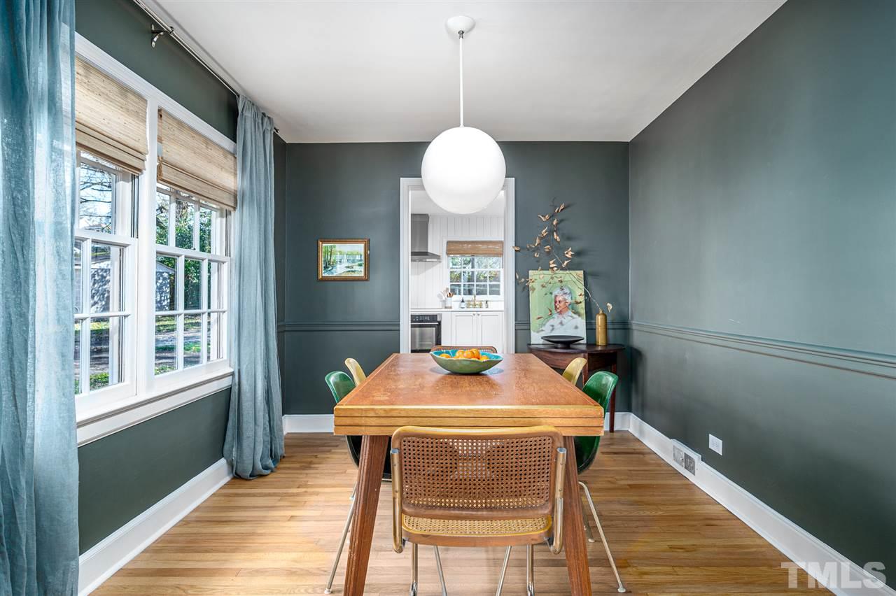 311 Dacian Avenue Durham, NC 27701 - Photo 6 of 30 a dining room with chandelier and wooden floor