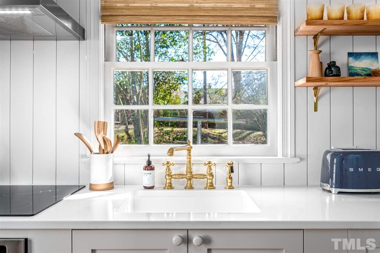 311 Dacian Avenue Durham, NC 27701 - Photo 9 of 30 a kitchen with a sink and a window