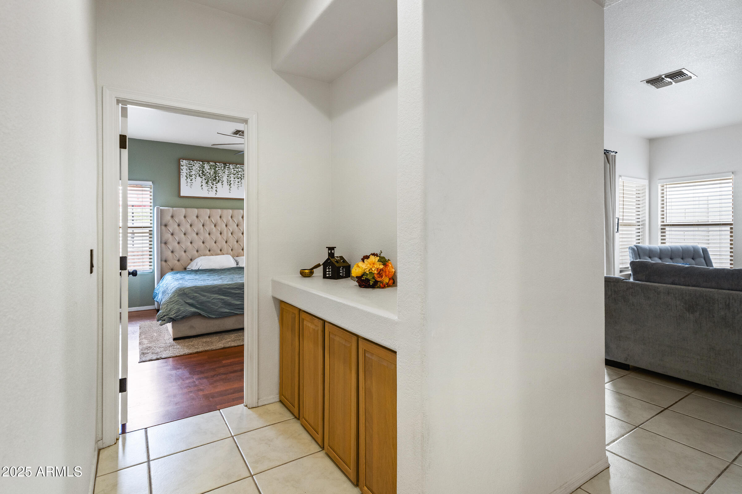 1140 South Rockwell Street Gilbert, AZ 85296 - Photo 17 of 29 a hallway with a couch and a stove top oven