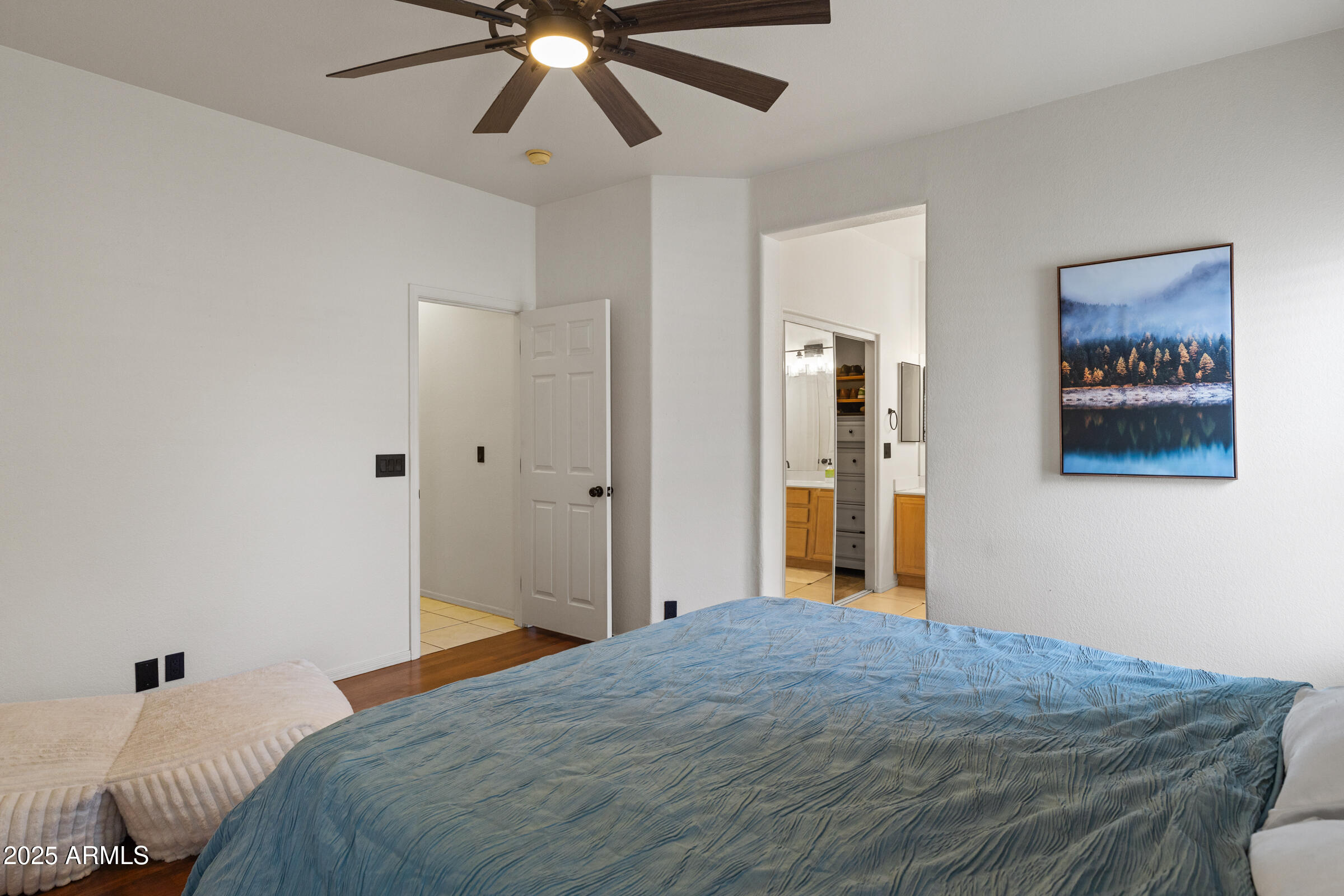 1140 South Rockwell Street Gilbert, AZ 85296 - Photo 19 of 29 a bedroom with a bed and a chandelier