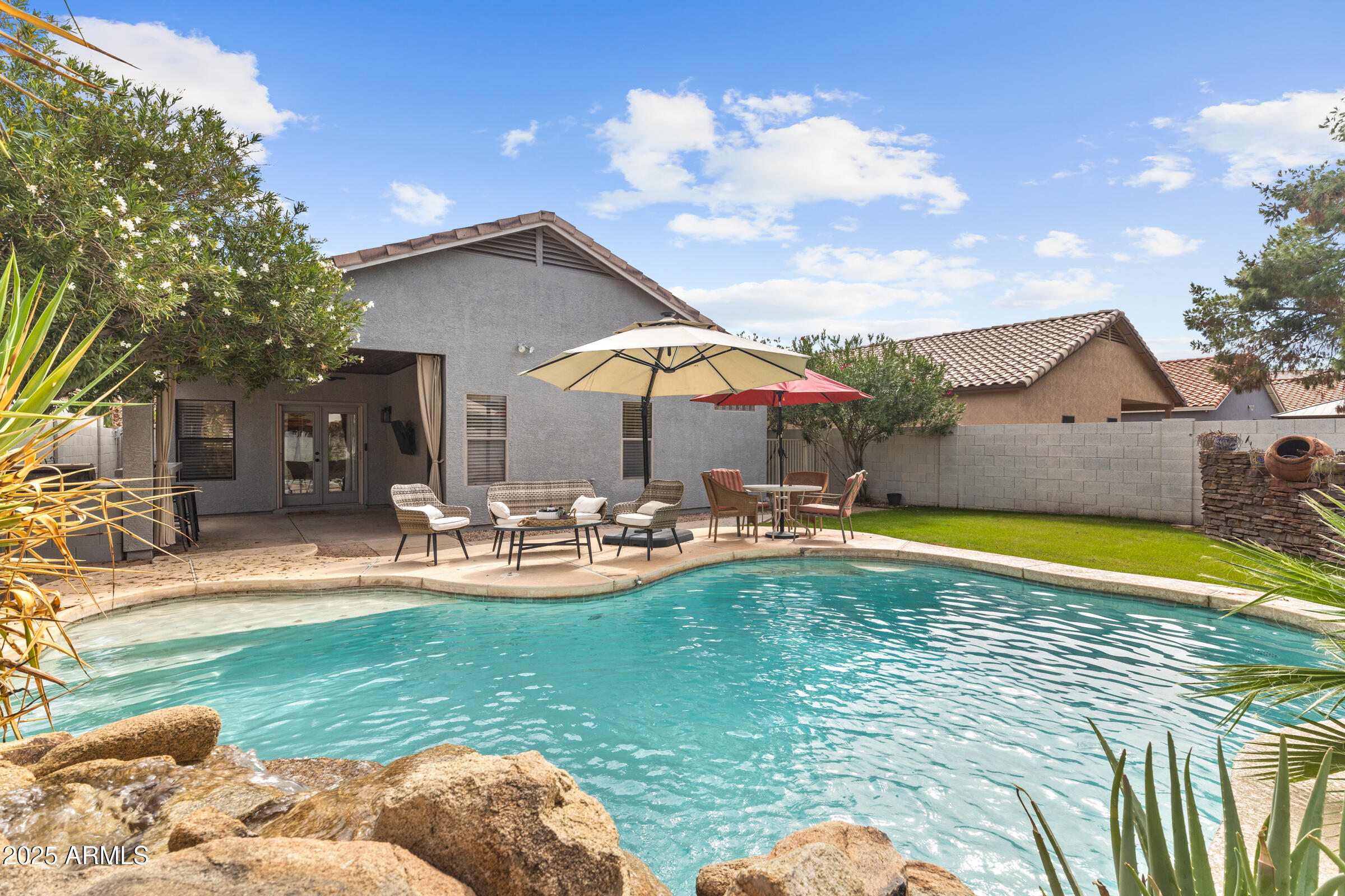 1140 South Rockwell Street Gilbert, AZ 85296 - Photo 24 of 29 a view of a swimming pool with a patio