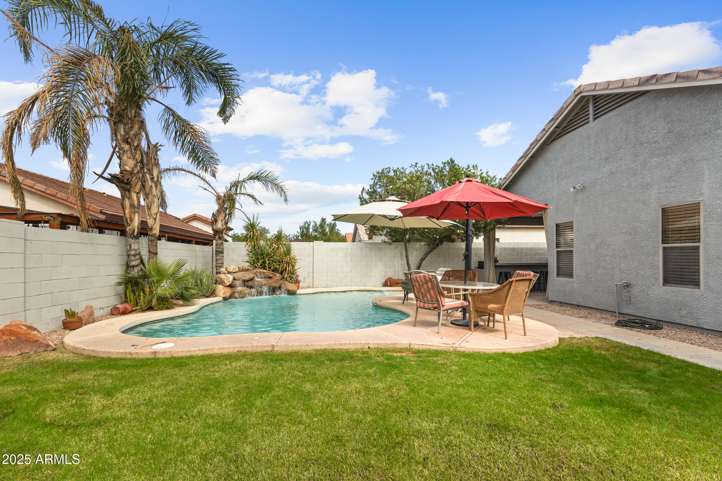 1140 South Rockwell Street Gilbert, AZ 85296 - Photo 28 of 29 a view of a backyard with a patio and outdoor seating