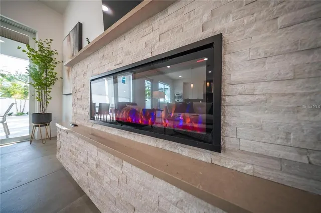 a bedroom with a bed and a lamp