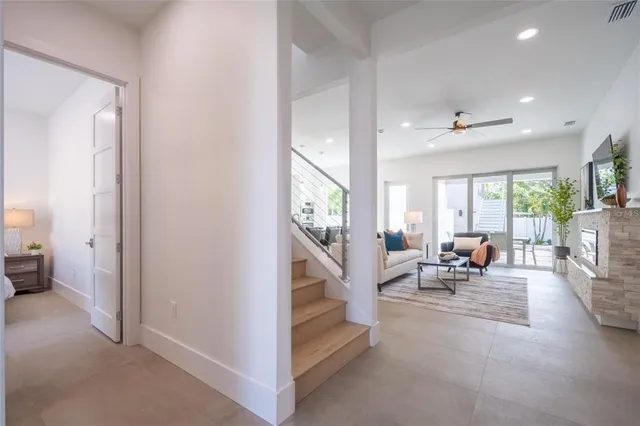 a bedroom with a balcony a bed and a view of balcony