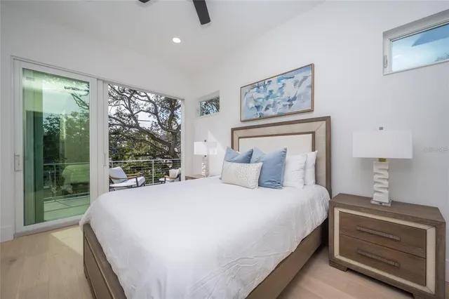 a bedroom with a large bed and a window