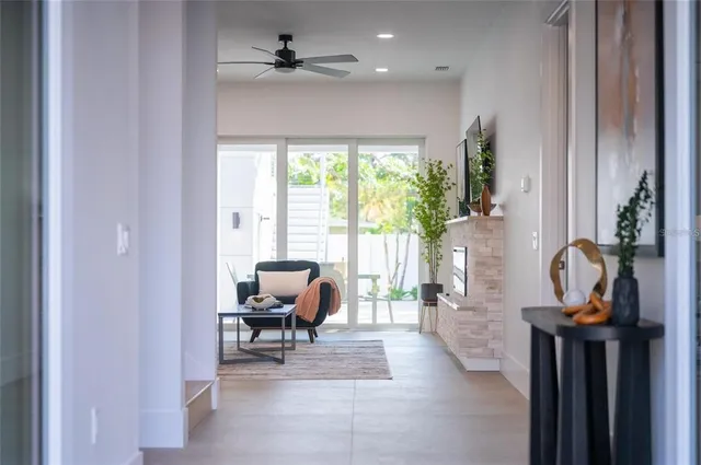 a kitchen with stainless steel appliances granite countertop a sink a stove and a refrigerator