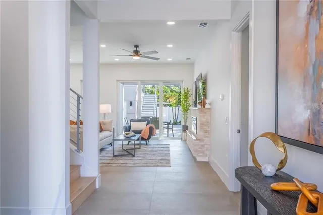 a kitchen with stainless steel appliances granite countertop a sink stove refrigerator and cabinets