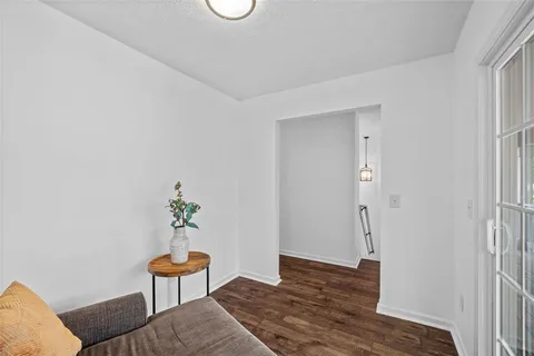 a bedroom with a bed and a potted plant