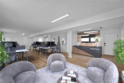 a view of swimming pool with seating area