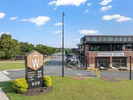 a sign that is sitting in front of a building