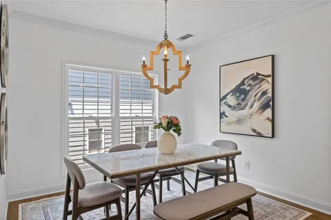 a view of a dining room with furniture and window