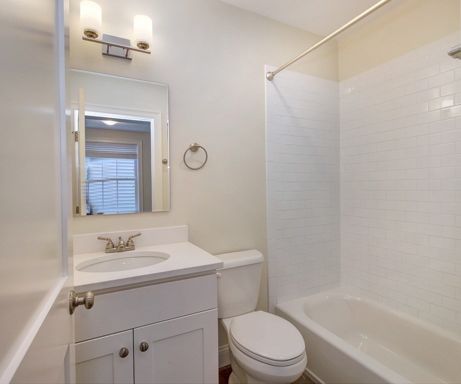 4 Kemp Street, Unit 4 Boston, MA 02127 - Photo 16 of 40 a bathroom with a sink toilet and shower
