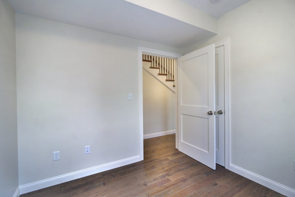 4 Kemp Street, Unit 4 Boston, MA 02127 - Photo 19 of 40 a view of empty room with wooden floor