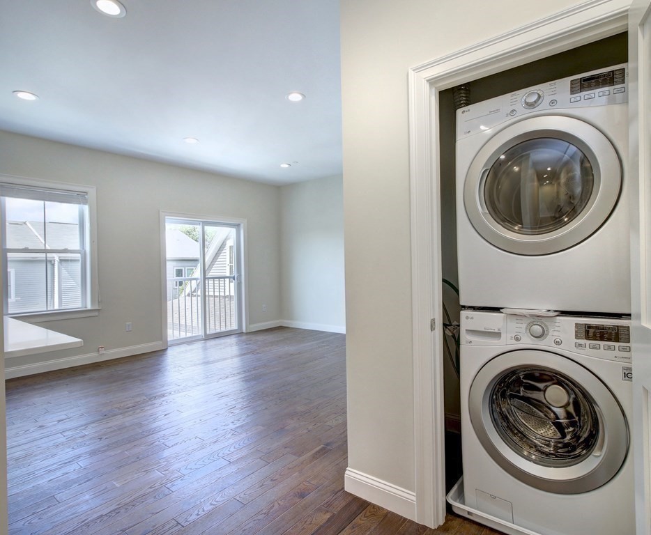 4 Kemp Street, Unit 4 Boston, MA 02127 - Photo 21 of 40 a view of a hallway with washer and dryer