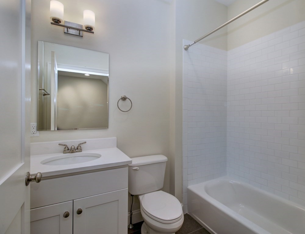 4 Kemp Street, Unit 4 Boston, MA 02127 - Photo 29 of 40 a bathroom with a sink toilet and shower
