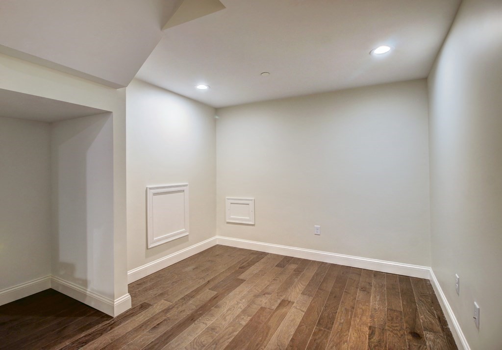 4 Kemp Street, Unit 4 Boston, MA 02127 - Photo 38 of 40 wooden floor in an empty room