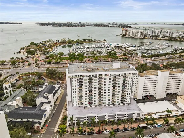 a bathroom with a granite countertop toilet sink and mirror