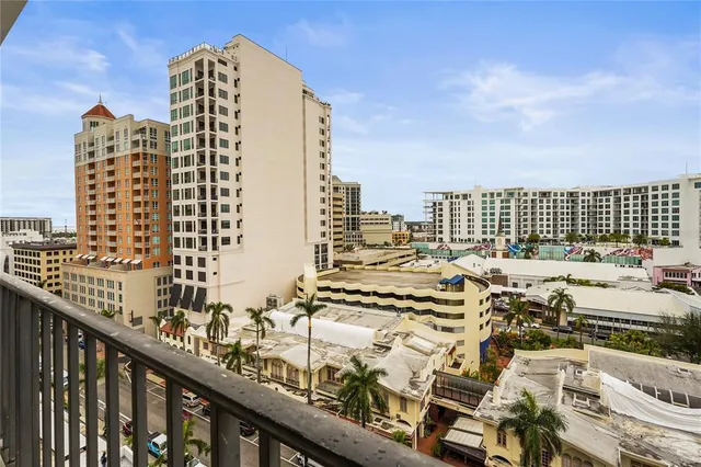 a kitchen with stainless steel appliances granite countertop a sink and a refrigerator