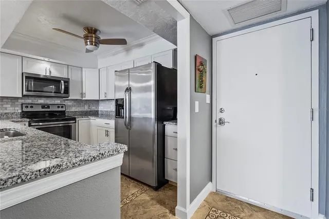 a view of a dining room kitchen and a window
