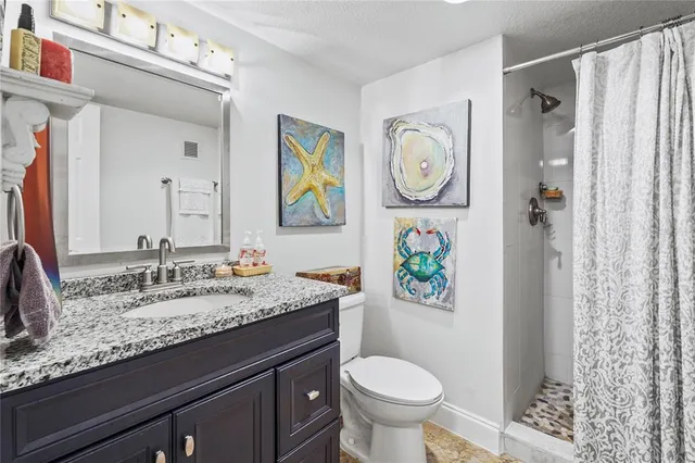 a living room with furniture a rug and a large window