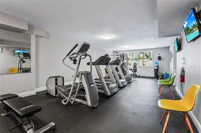 a view of balcony with two large window and wooden fence